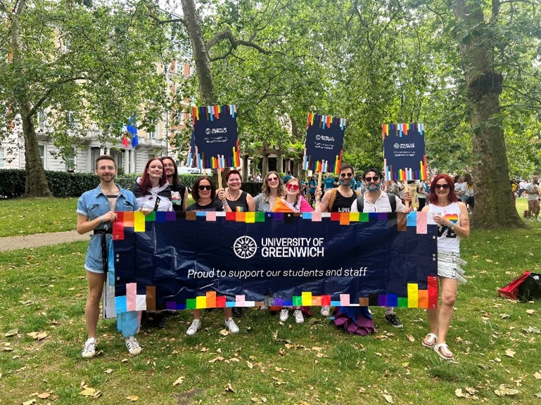 University of greenwich staff and LGBT+ Staff Community with a UoG banner for the pride march