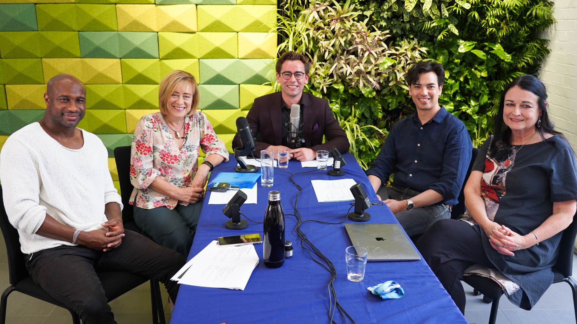 podcast guests at a table 