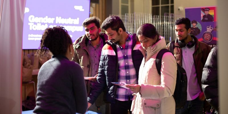 An image of students at a Careers Fair talking to an employer.