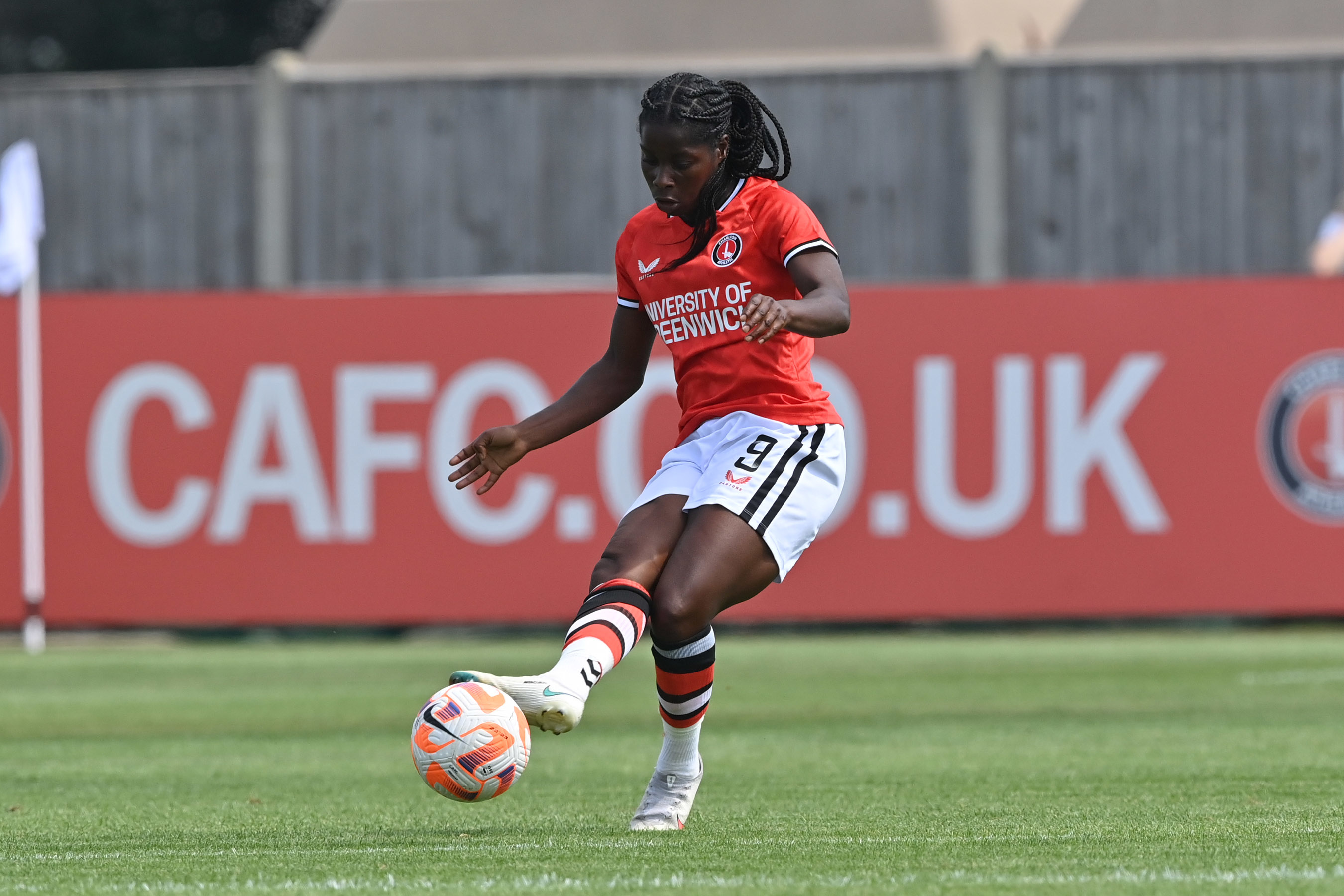 Charlton player kicking a ball